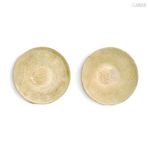 A pair of Qingbai moulded 'phoenix' bowls, Song dyna...