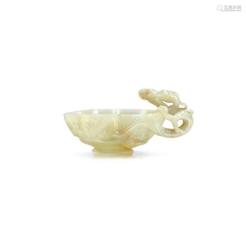 A superbly carved and extremely rare celadon jade 'drago...