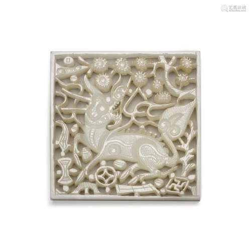 A reticulated white jade ‘qilin' belt plaque, Ming dynas...