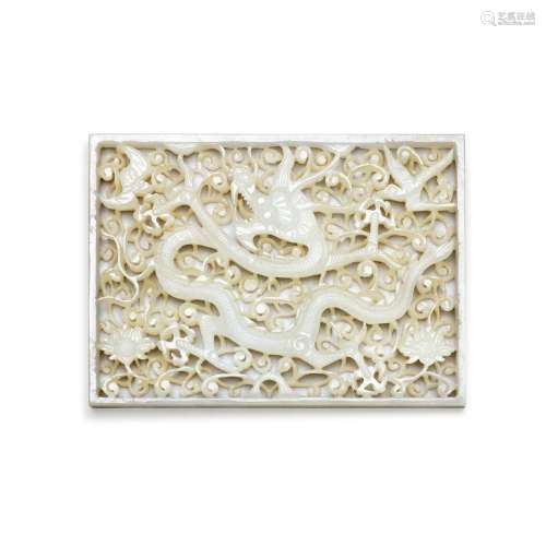 A reticulated white jade 'dragon' belt plaque, Ming ...