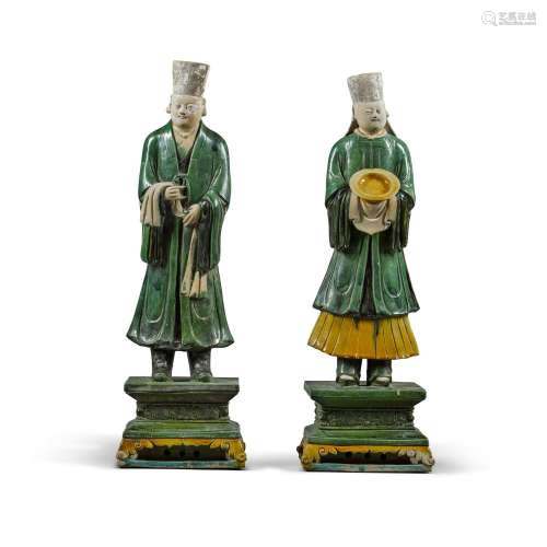 Two rare large pottery sancai-glazed attendants, Ming dynast...
