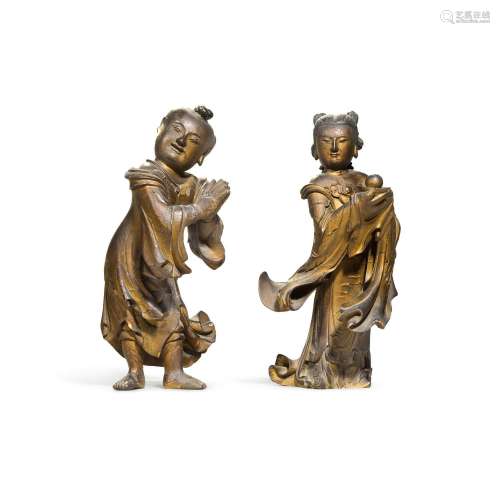 Two gilt-lacquered wood standing acolytes, Late Ming dynasty...