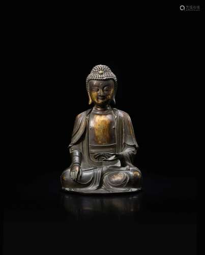 A parcel-gilt bronze figure of Shakyamuni Buddha, Ming dynas...