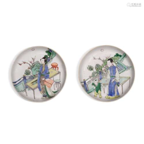 A pair of famille-verte 'lady and child' saucers, Qi...