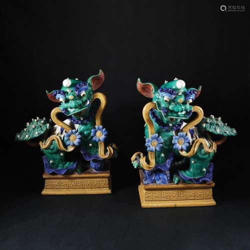 A pair of Asian polychrome ceramic figures of A Foo dog, 19t...