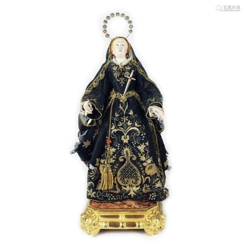 A Neapolitan polychrome wood sculpture of the Virgin of Sorr...