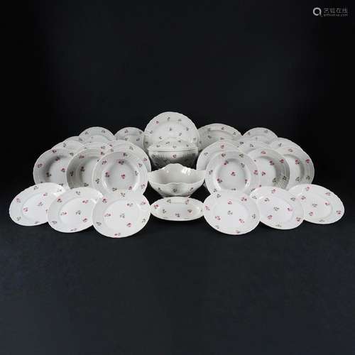 A white and polychrome porcelain dinner service, Richard Gin...