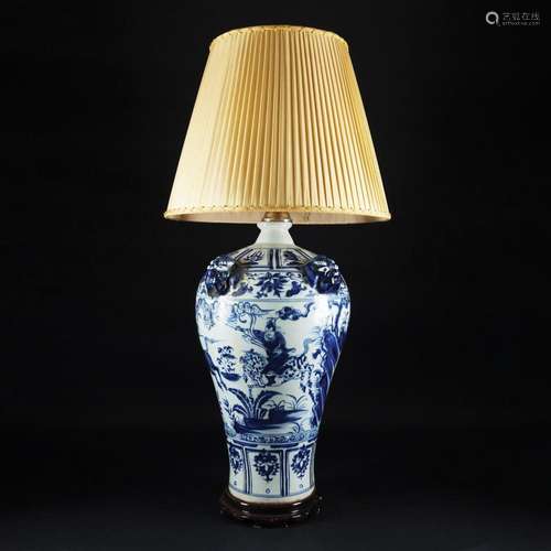 An electrified white and blue porcelain vase with lampshade