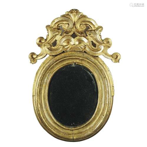 A carved gilt oval wall mirror, 18th century