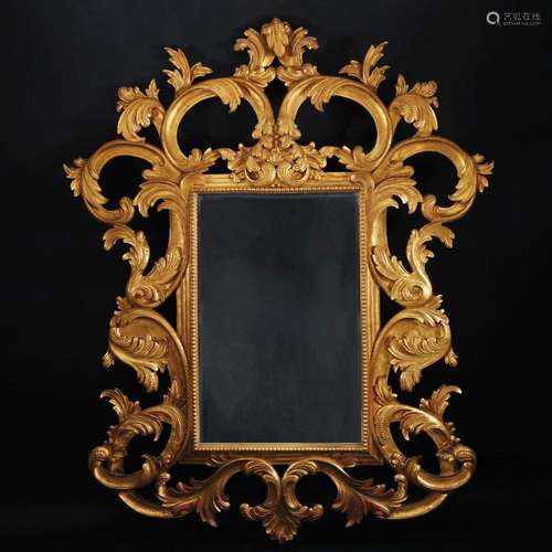 A large carved gilt wood wall mirror