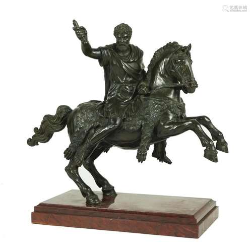 A patinated bronze group with a Roman emperor on horseback, ...