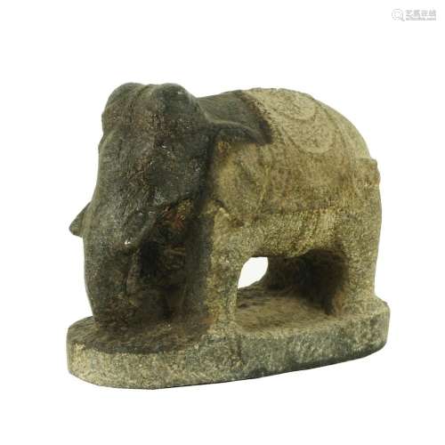 An antique stone figure of an elephant