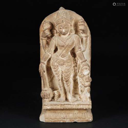 A pink stone high-relief with a goddess with 4 arms, Asiatic...