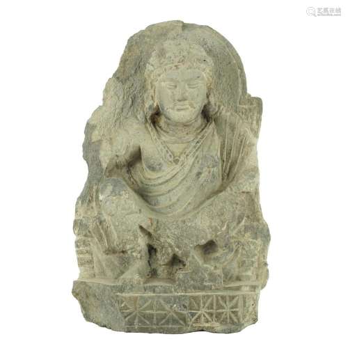 An antique shale fragment of sitting Buddha