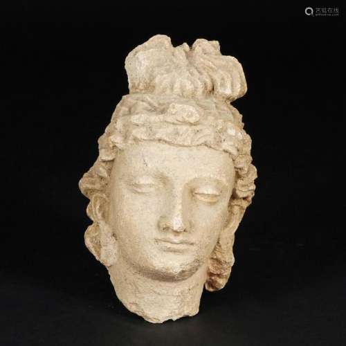 An antique terracotta fragment of a female head