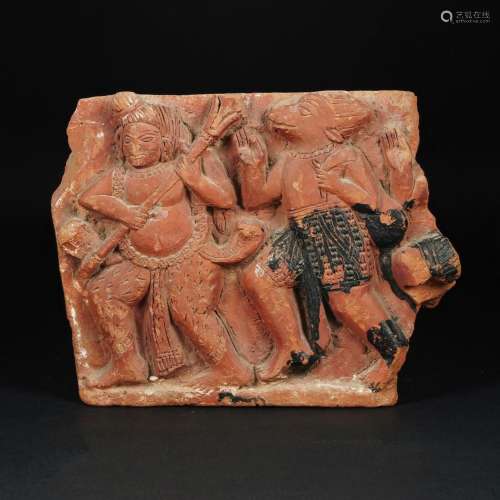 An antique red clay fragment of a low-relief, Asiatic art