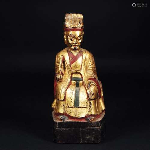 2 Chinese polychrome and gilt wood figures of a sitting divi...