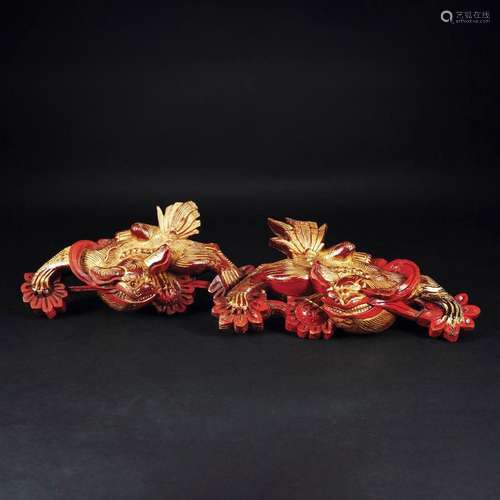 A pair of Chinese lacquered and gilt wood friezes with a dra...