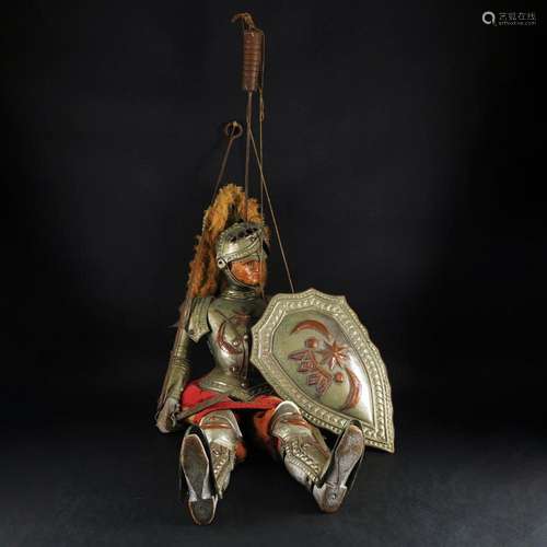 A polychrome wood and embossed metal Sicilian pupo, 20th cen...