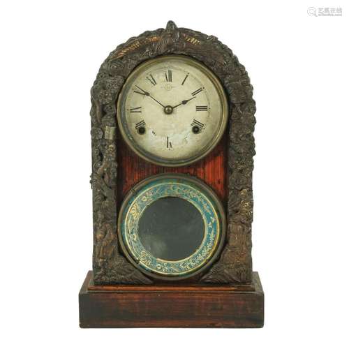 A painted wood arched mantel clock with embossed metal decor...