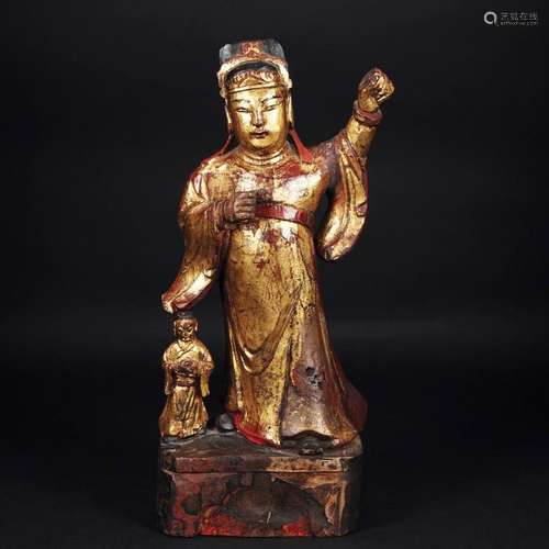 A Chinese gilt and lacqauered wood figure of a warrior divin...