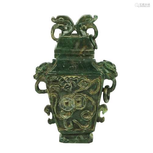 A Chinese carved green hard stone vase and cover, 19th centu...