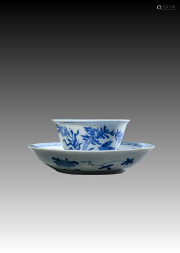 A set of blue and white flower and bird saucers