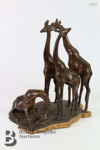 A well carved African giraffe group