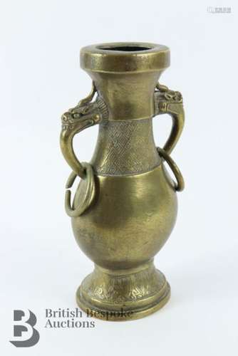 Chinese bronze vase having dragon mask handles with incised ...