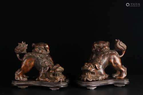 A pair of old Tibetan Chihu bowing head ornaments