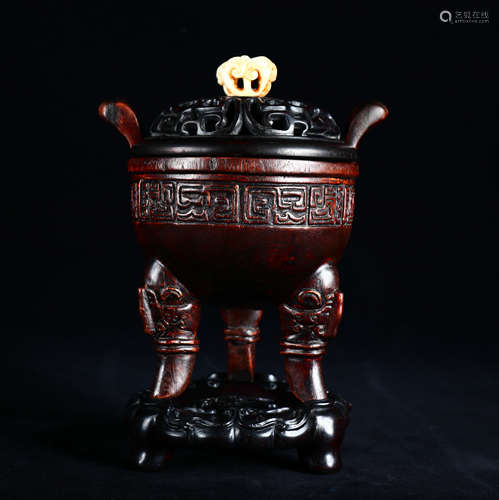 An old collection of red sandalwood three-legged incense bur...