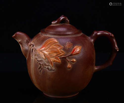 A zisha teapot with flower pattern