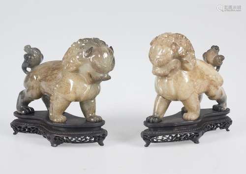 Pair of serpentine lions. China. 20th century.