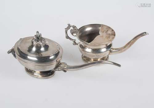 Pair of silver milk jugs, both marked. One is stamped "...