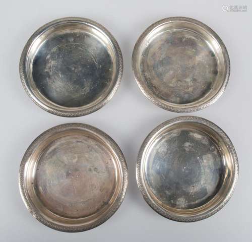 Set of four silver bottle bases. Marked "Carreras"...