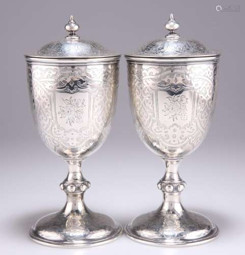 A FINE PAIR OF VICTORIAN SILVER GOBLETS AND COVERS