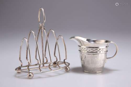 AN ARTS AND CRAFTS SILVER CREAM JUG AND A GEORGE V SILVER TO...