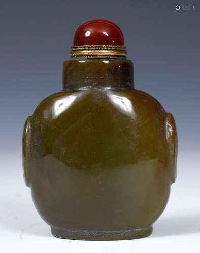A Chinese green stone snuff bottle, with an amber coloured s...