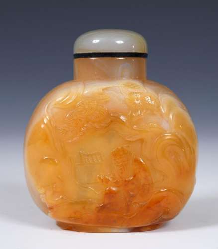 A Chinese carved hardstone snuff bottle, with a stopper, 8 c...