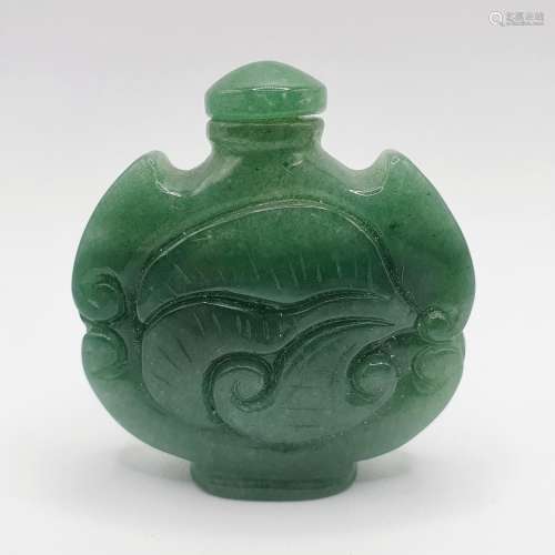 A Chinese carved green stone snuff bottle, 6 cm high Provena...