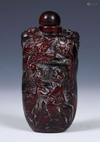 A Chinese carved amber coloured snuff bottle, 7 cm high Prov...