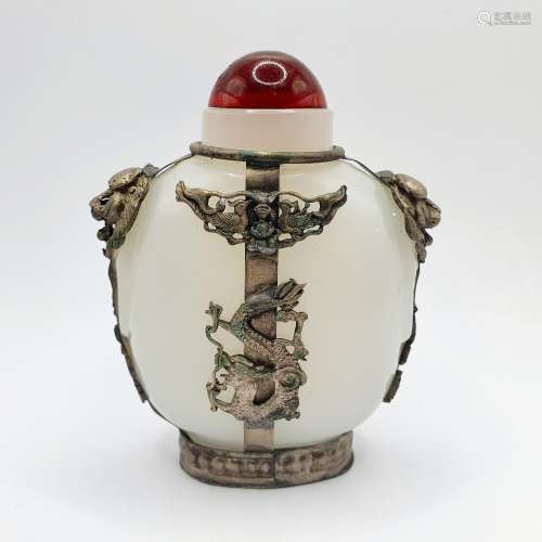 A Chinese white stone snuff bottle, with metal mounts and an...