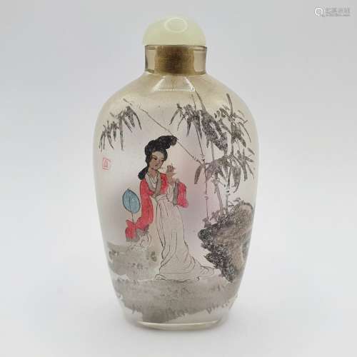 A Chinese glass snuff bottle, the interior painted a figure,...