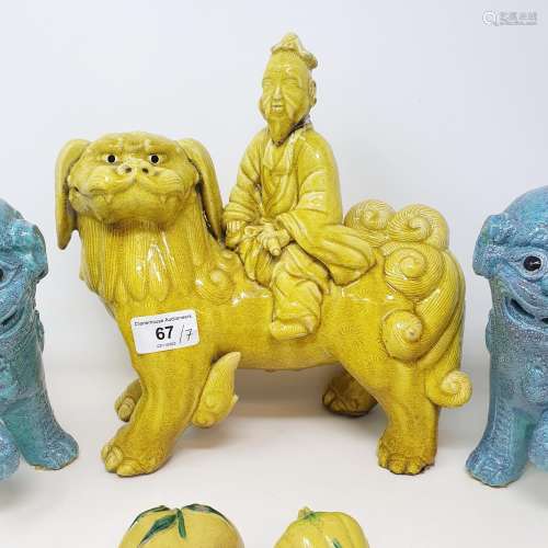 A Chinese yellow ground Dog of Fo ridden by a figure, 28 cm ...