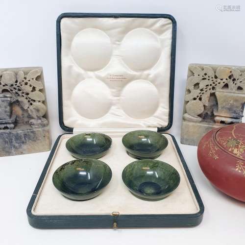 A set of four jade bowls, cased, a red lacquered circular bo...