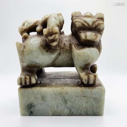 A Chinese green stone seal, in the form of a lion, 12 cm hig...