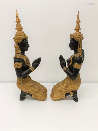 A pair of painted metal figures of goddesses, 33 cm high