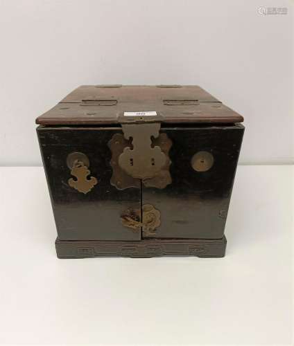 A Chinese hardwood and brass bound box, with a fitted interi...