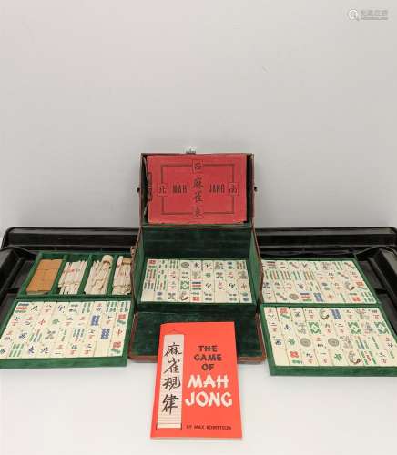 A Mah-Jong set, in a leather case, and four stands