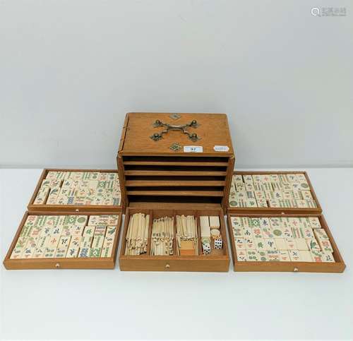 A Mah-Jong set, in a hardwood case with gilt metal mounts